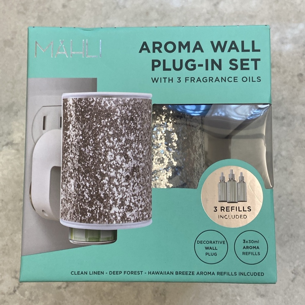 Mahlo Aroma Wall Plug-in Set withh 3 fragrance w refills. Box is unopened.